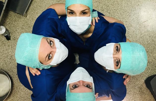 Ardian Interview with ELSAN, bird's eye view of a team of nurses hugging each other and looking towards us